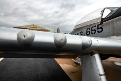 Close-up of airplane against sky