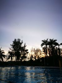 Scenic view of sea against clear sky at sunset