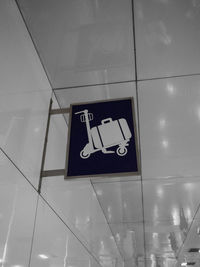 Low angle view of information sign on floor