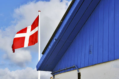 Low angle view of flag against sky