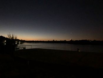 Scenic view of silhouette landscape against clear sky at night