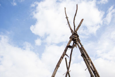 Low angle view of crane against sky