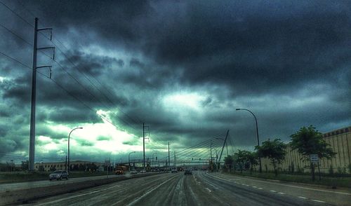 View of road against cloudy sky