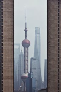 Oriental pearl tower and shanghai tower against sky