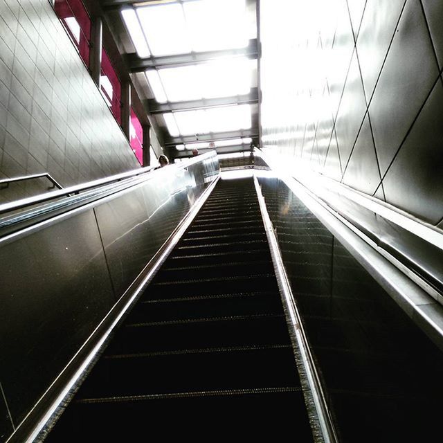 steps and staircases, steps, staircase, indoors, escalator, railing, architecture, built structure, the way forward, low angle view, diminishing perspective, modern, transportation, technology, convenience, vanishing point, building, moving up, stairs, high angle view