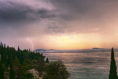 Scenic view of sea against storm clouds