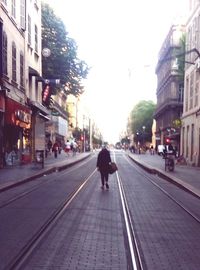 Woman walking on city street