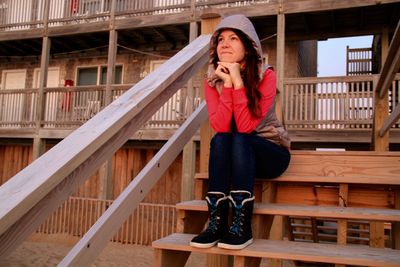 Young woman sitting on steps