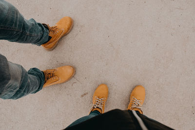 Low section of people standing on road