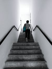 Rear view of man on steps