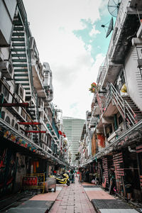 Street amidst buildings against sky