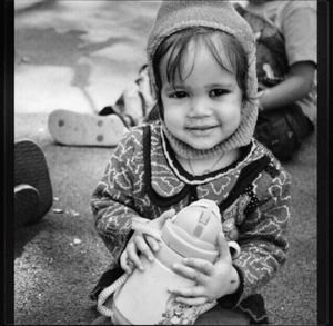 Portrait of cute girl holding toy