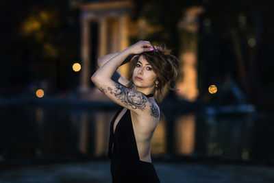 Portrait of fashionable woman standing outdoors