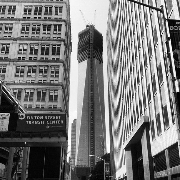 architecture, building exterior, built structure, city, skyscraper, tall - high, modern, tower, office building, low angle view, building, capital cities, tall, travel destinations, city life, sky, development, day, glass - material, financial district