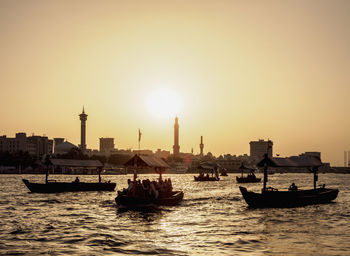 View of boats in sea against buildings