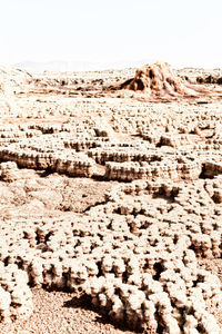 View of rocks on beach against clear sky