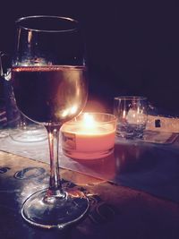 Close-up of wine glasses on table