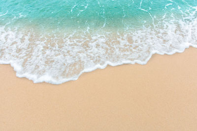 High angle view of surf on beach