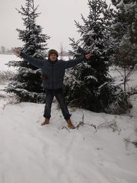 Man standing on snow covered field