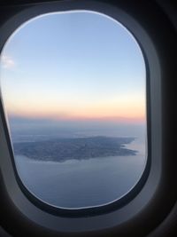 Scenic view of landscape seen through airplane window