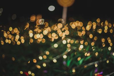 Defocused image of illuminated lights at night