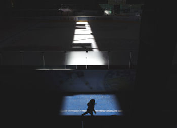 Silhouette man in corridor