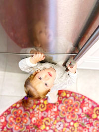 High angle portrait of woman with baby at home