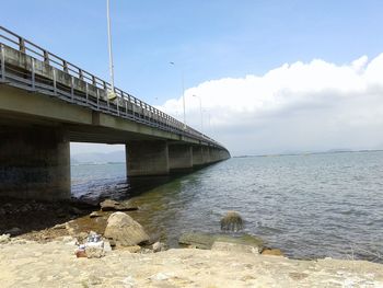 Low angle view of bridge over sea