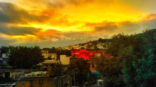 View of cityscape against sky at sunset