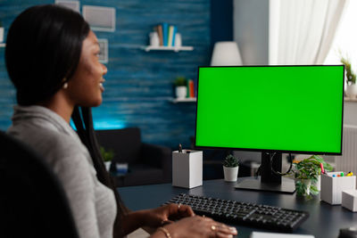 Young woman using laptop at home