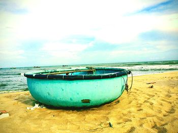 Boat moored on beach