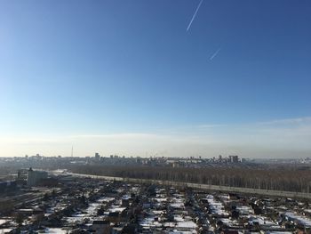 High angle view of buildings in city against sky