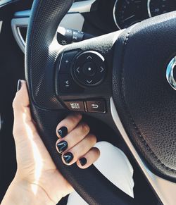 Close-up of hand holding car