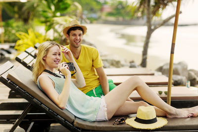 Smiling young couple at beach