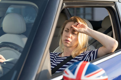 Woman sitting in car