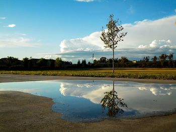 Scenic view of landscape against cloudy sky