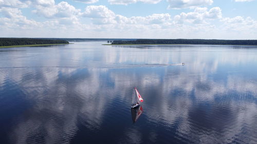 High angle view of person in lake against sky