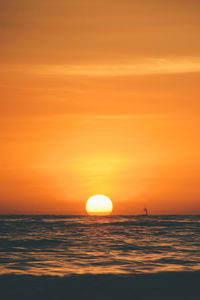 Scenic view of sea against romantic sky at sunset