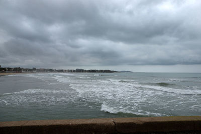 Scenic view of sea against cloudy sky