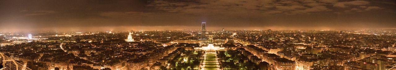 High angle view of city lit up at night