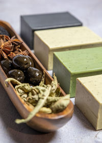 Different types of aleppo soap olive oil,anise, nigella sativa, bay laurel.