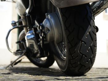 Close-up of motorcycle parked on road