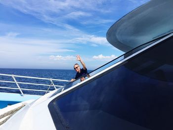 Man on boat against sky