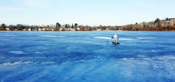 Scenic view of snow covered landscape against clear sky