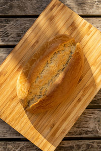 High angle view of bread on cutting board