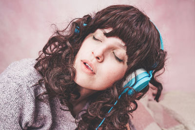 Woman listening music at home