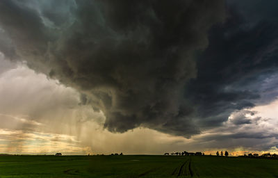 Scenic view of dramatic sky over land