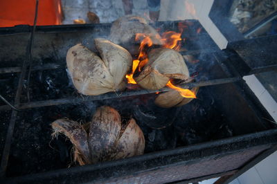 Close-up of coconut on barbecue grill