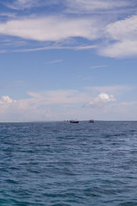 Blue ocean with ships cruising in semporna, borneo, sabah.