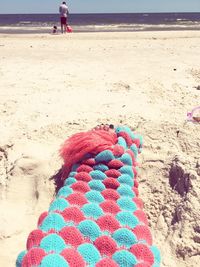 Full length of woman on beach against sky
